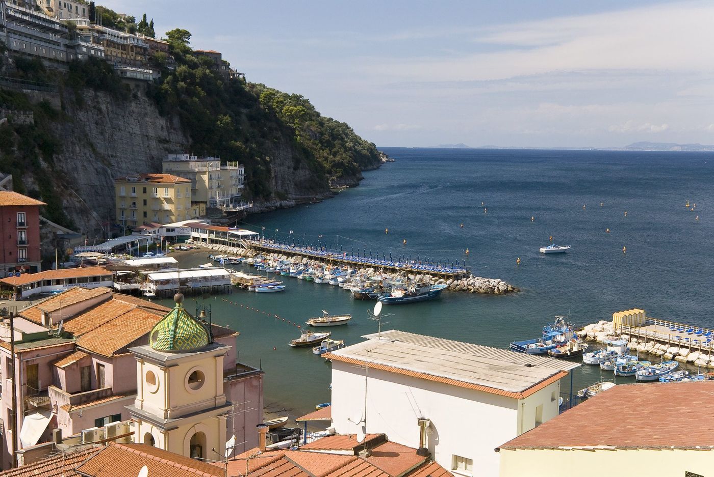 Sorrento above its marina, with fishing boats and the bay beyond
